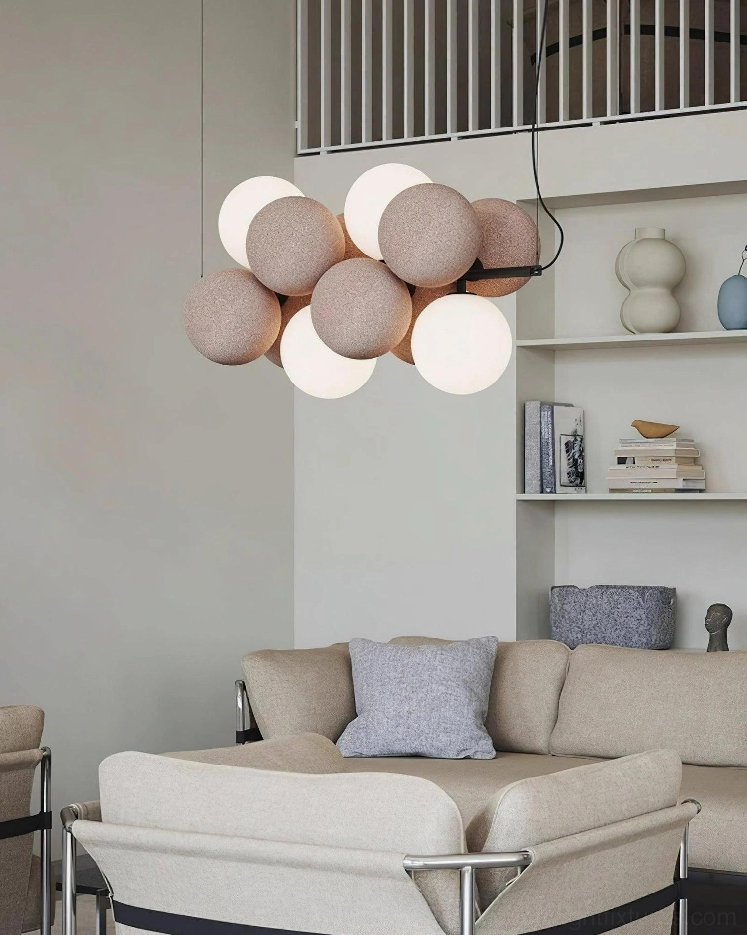 Front view of bubble cluster pendant light in contemporary living lounge with light tan off-white spherical shades