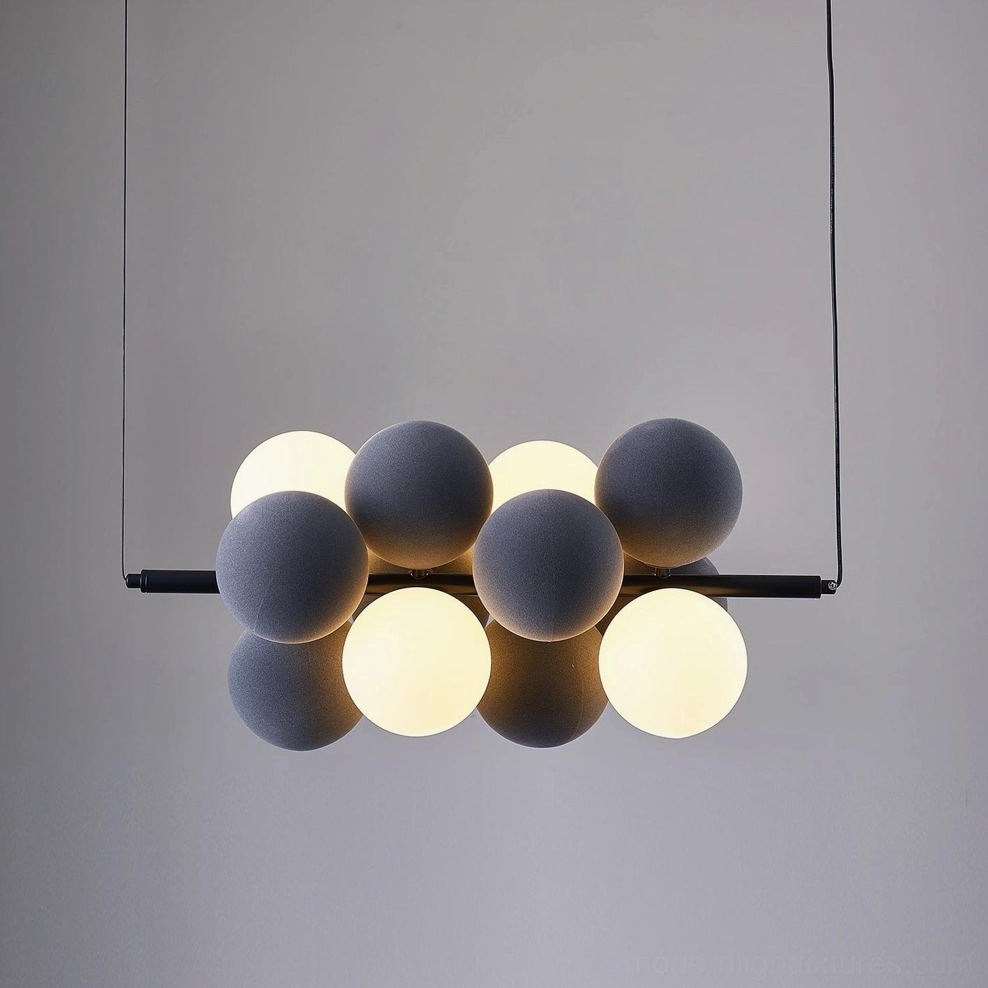 Bubble cluster pendant light compact vertical configuration intimate dining space
