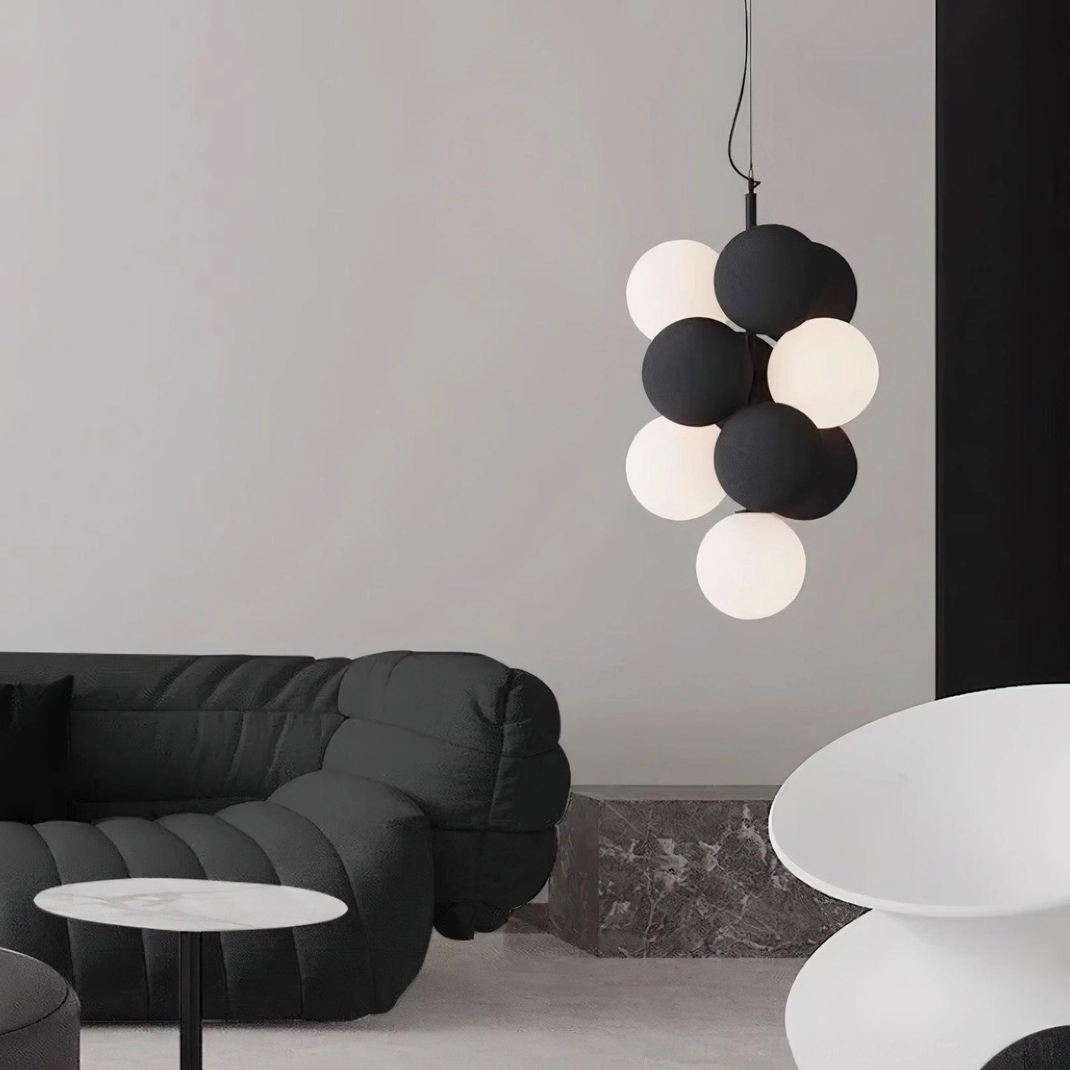 Bubble sphere pendant light fixture detail showing textured matte finish and warm diffused illumination