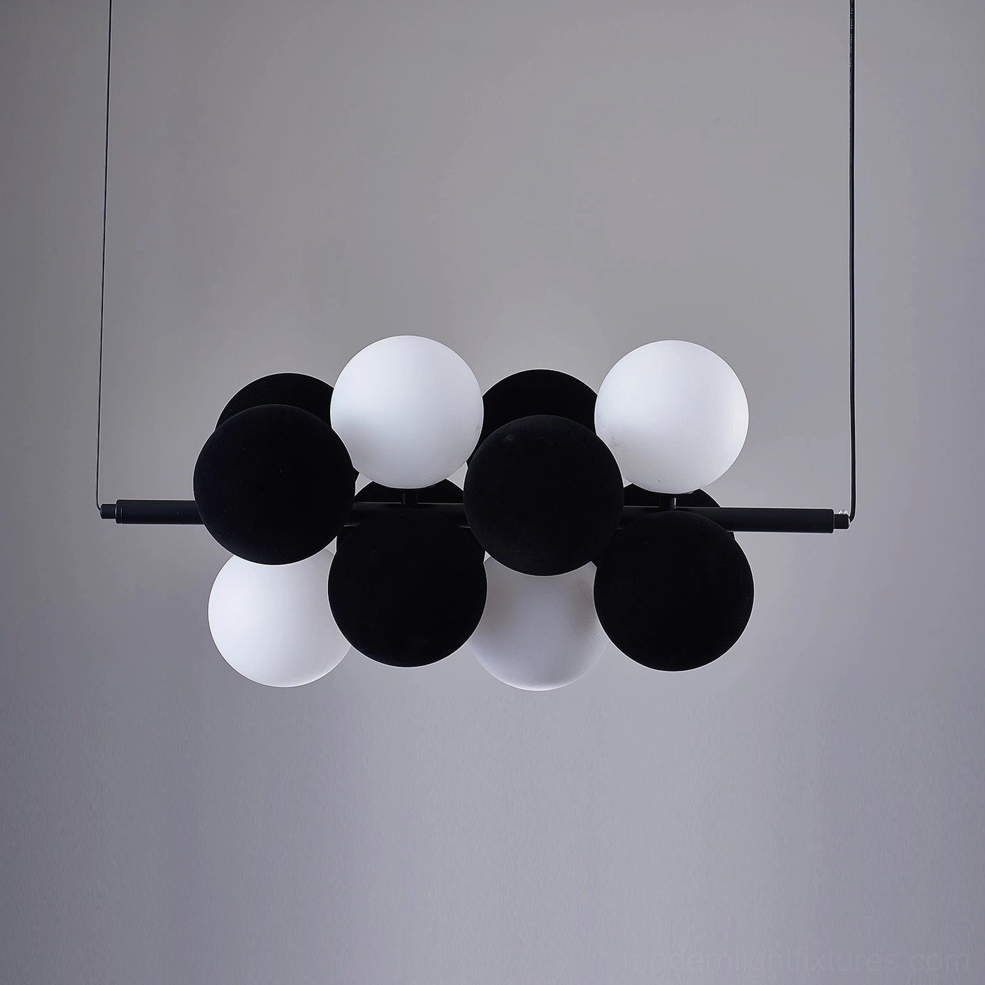 Horizontal linear bubble pendant light in commercial hospitality boutique hotel setting