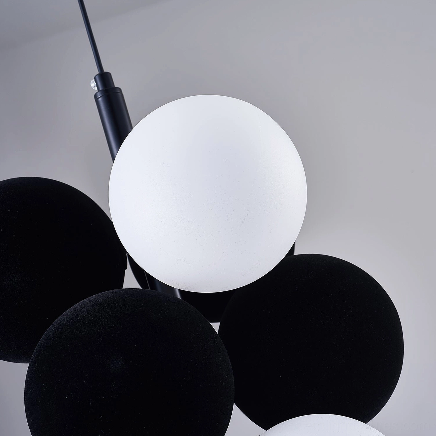 Horizontal linear bubble pendant light extended configuration over island counter