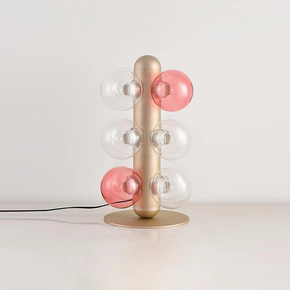 Hand-blown glass bubble table lamp left side view, dual-tone glass spheres with matte champagne gold metal frame