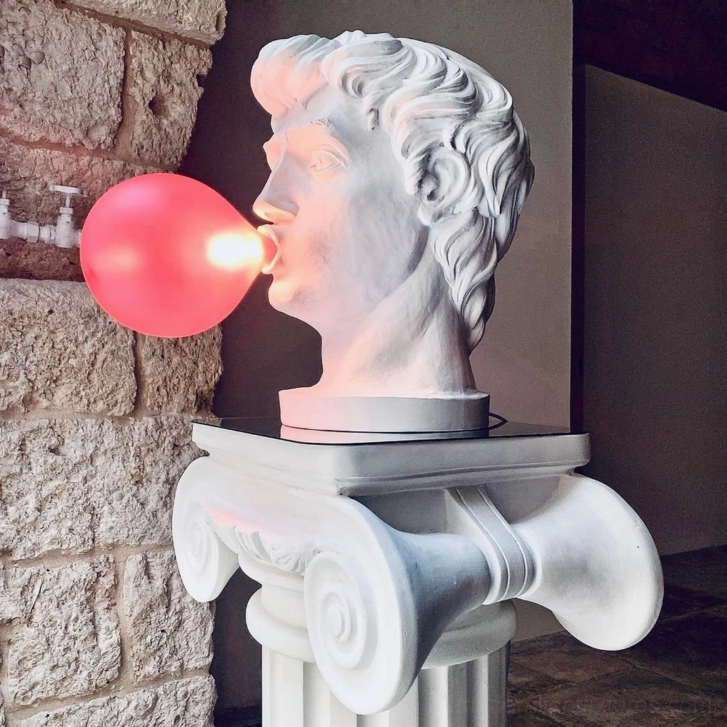 Bubblegum Boy resin lamp with power cord and plug visible, showing complete product setup