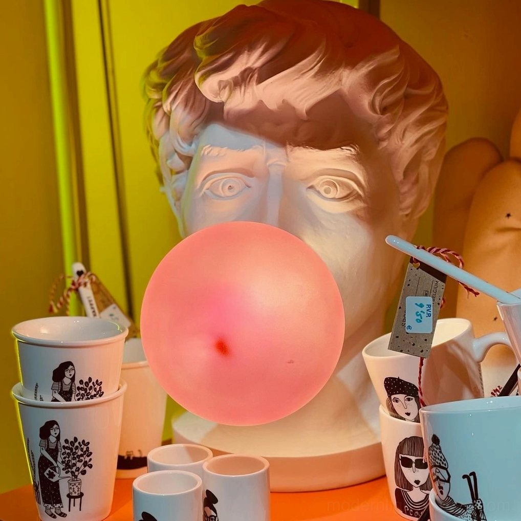 Bubblegum Boy table lamp warm pink glow creating flattering ambient light in modern living space