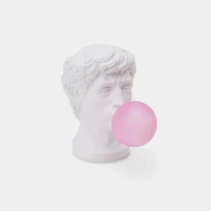 Bubblegum Boy resin table lamp with pink glass globe, front view on white background showing sculptural details