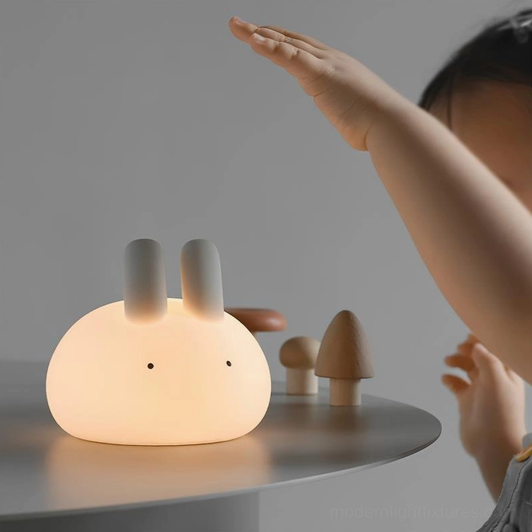 Touch-activated bunny night light placed near wooden mushroom toys in kids play area