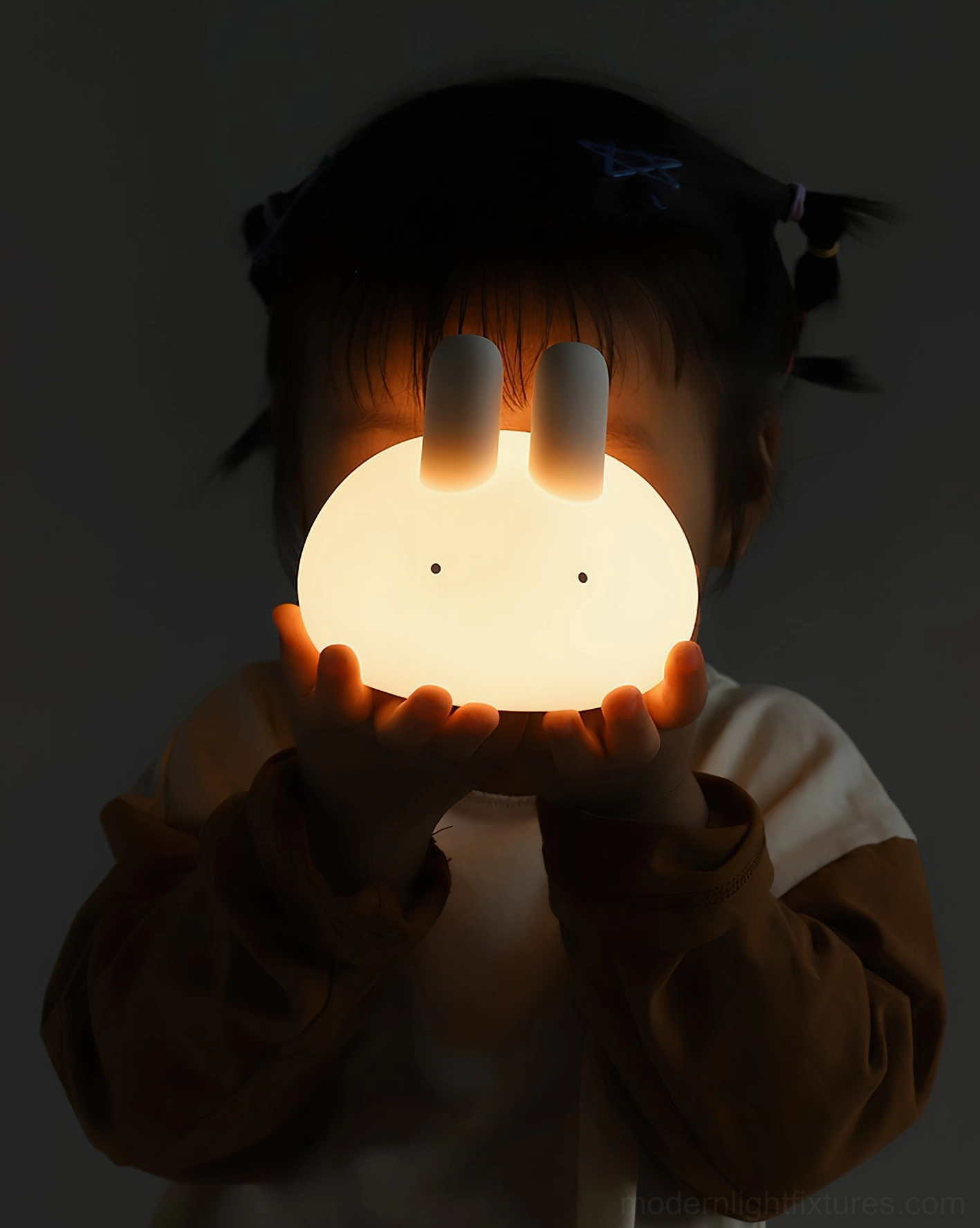 Pat switch touch control demonstration on white bunny shaped silicone night lamp