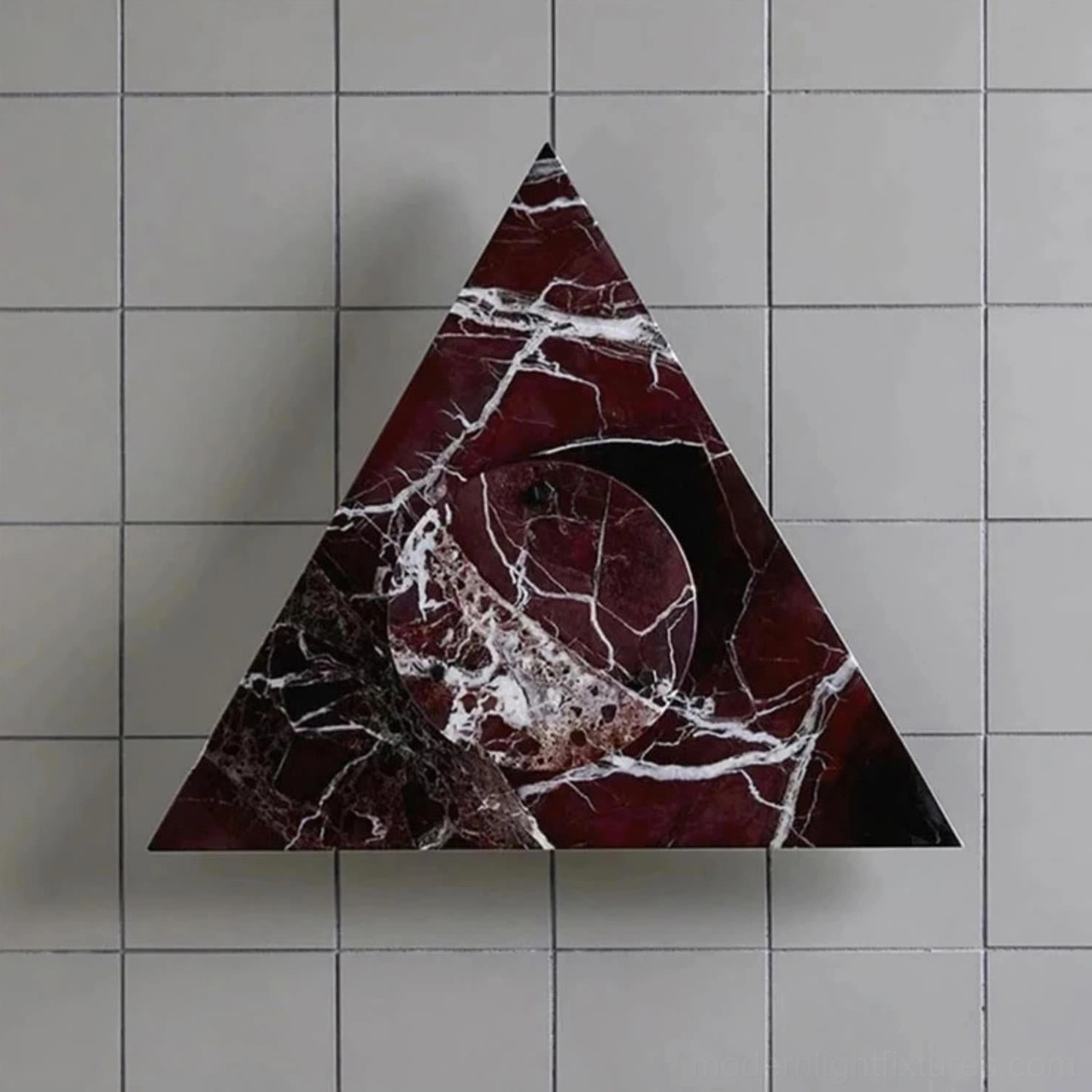 Burgundy red marble wall sconce with white stone veining and warm LED light