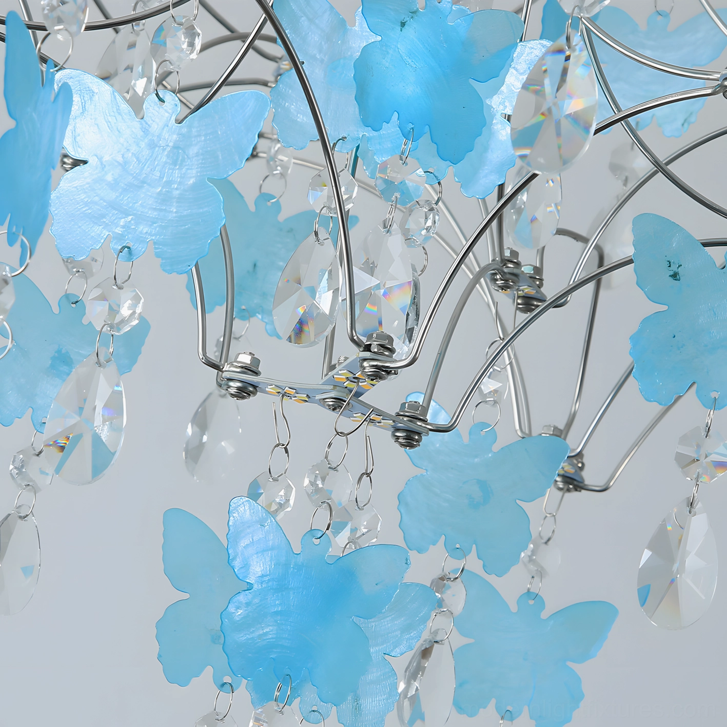 Butterfly dream crystal chandelier multiple color options displayed including silver, blue, white, pink and clear finishes for interior design coordination