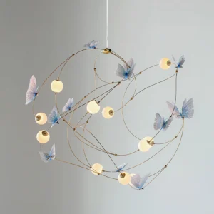 Contemporary butterfly chandelier side angle showing warm 3000K LED illumination with romantic luxury ambiance and acrylic shade elements