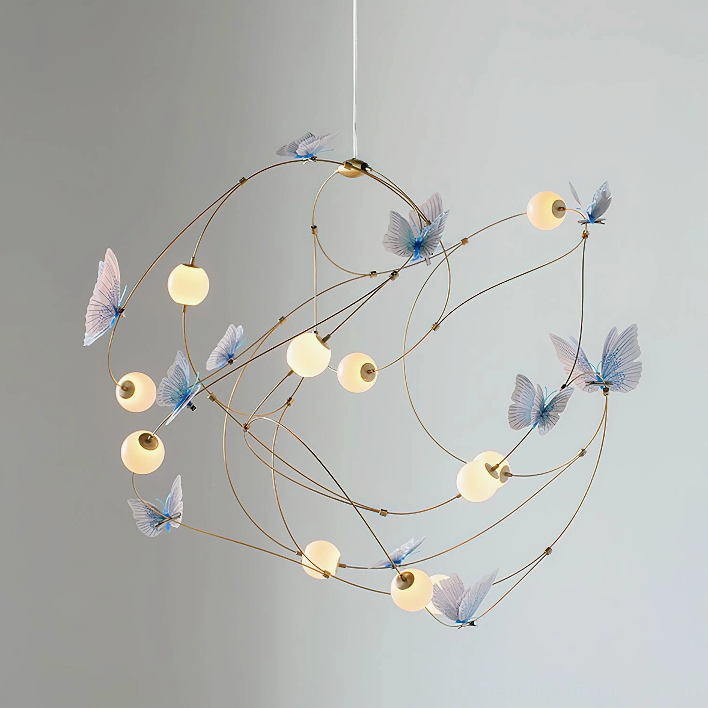 Contemporary butterfly chandelier side angle showing warm 3000K LED illumination with romantic luxury ambiance and acrylic shade elements