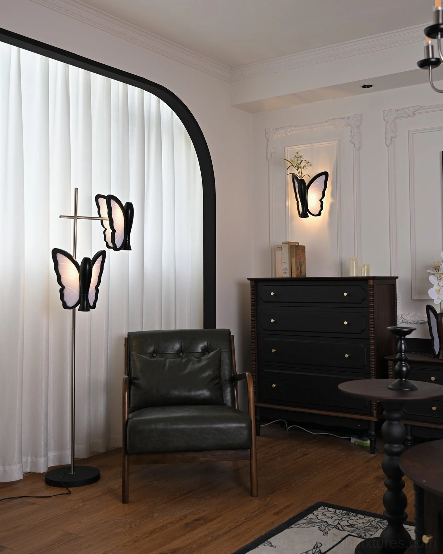 Butterfly floor lamp in modern living room setting, silver metal stand with black base, artistic butterfly-shaped lights
