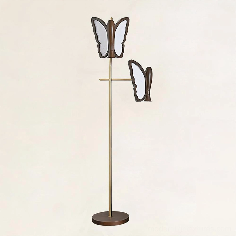 Modern butterfly floor lamp with dual lights, walnut colored wood base, brass gold metal pole, front facing view