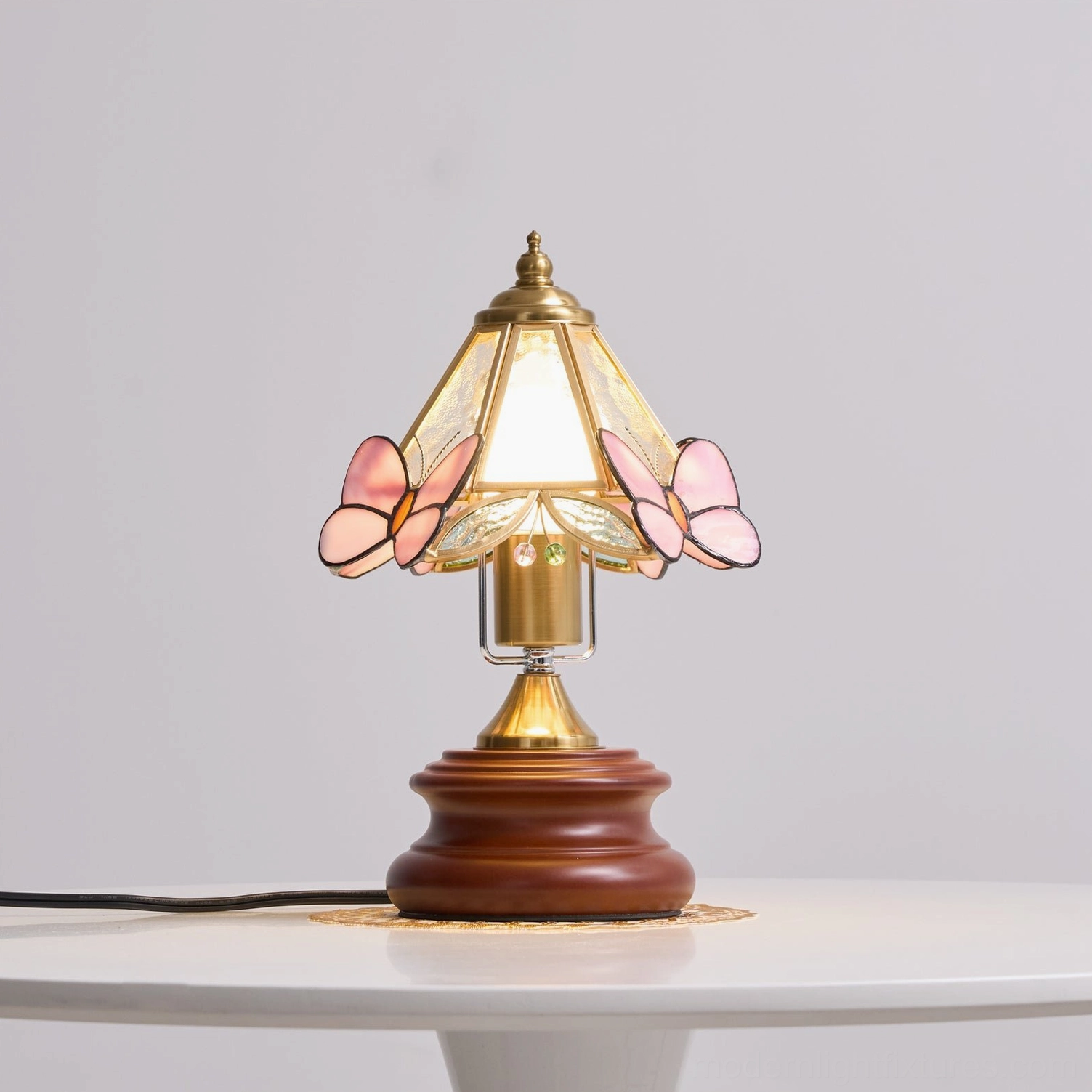 Pink stained glass butterfly lamp base construction showing walnut wood and metal assembly