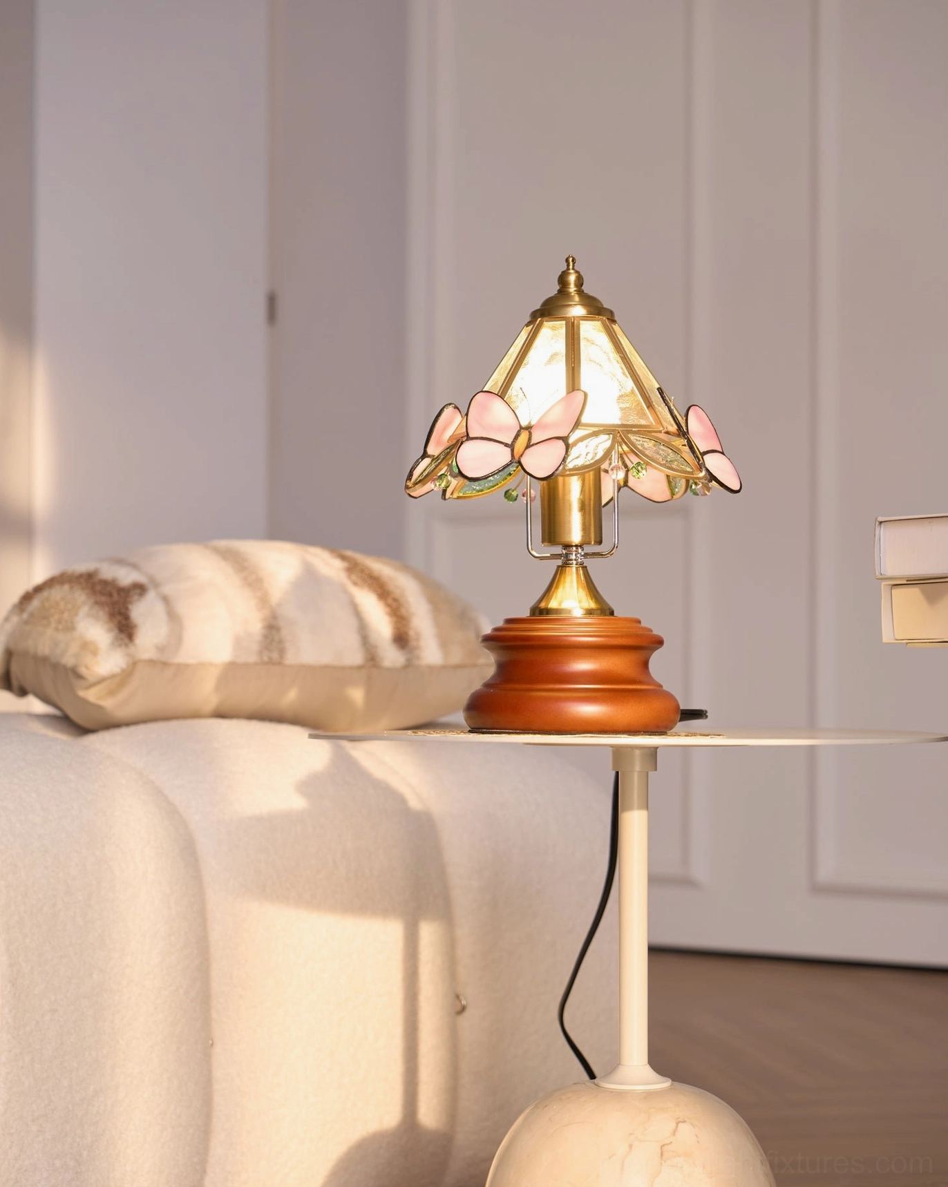 Tiffany butterfly table lamp creating ambient glow in home office or reading nook setting