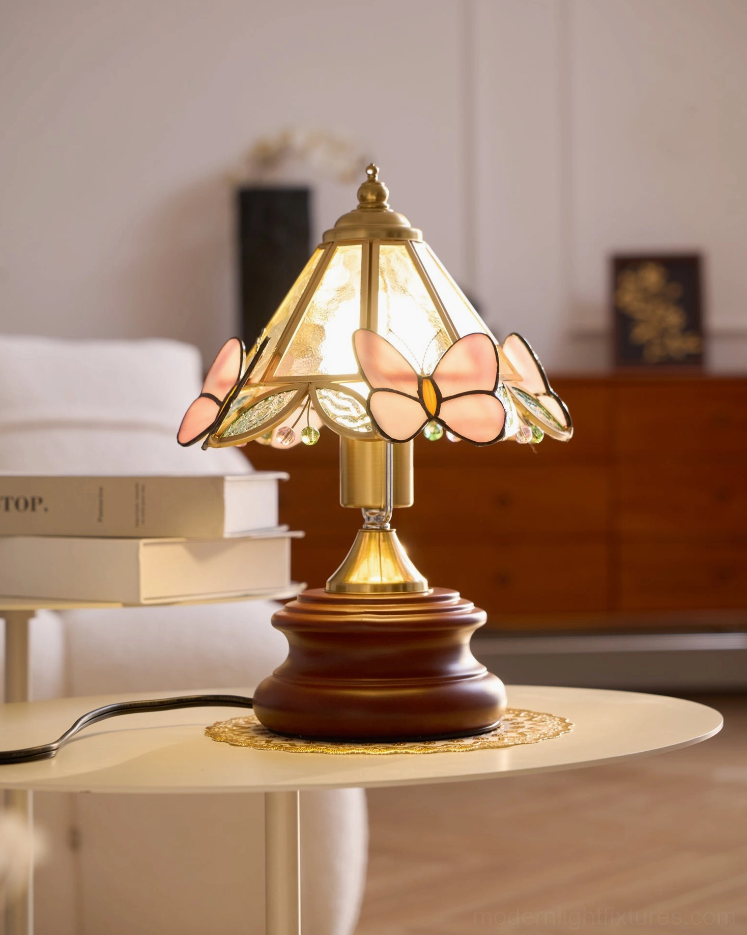 Vintage pink butterfly stained glass table lamp paired with interior design styling and accessories