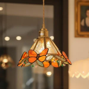 Butterfly stained glass pendant light hanging in warm home environment showcasing Tiffany vintage style