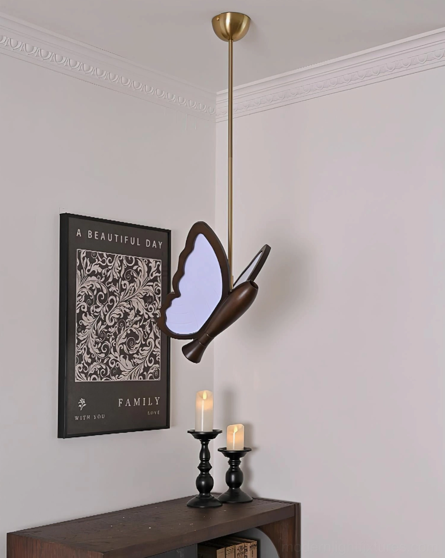 Butterfly pendant lamp showing sculptural form and light diffusion through frosted acrylic sections