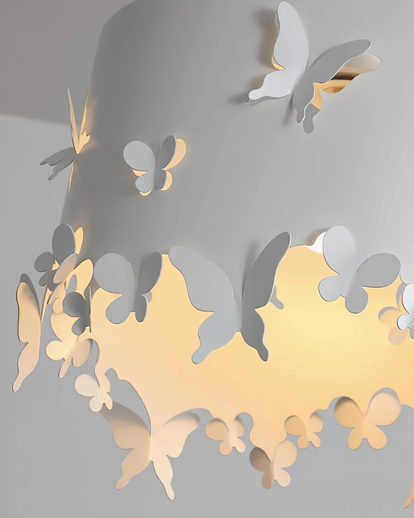 Close-up detail of Lunefly pendant lamp shade showing textured 3D butterfly accents with warm interior light glow