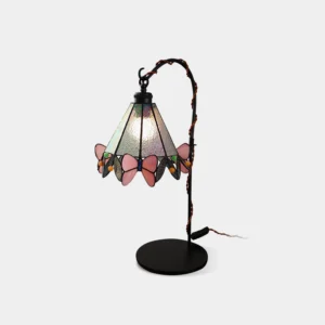 Front view of stained glass butterfly table lamp with black vine-inspired metal stand on white background