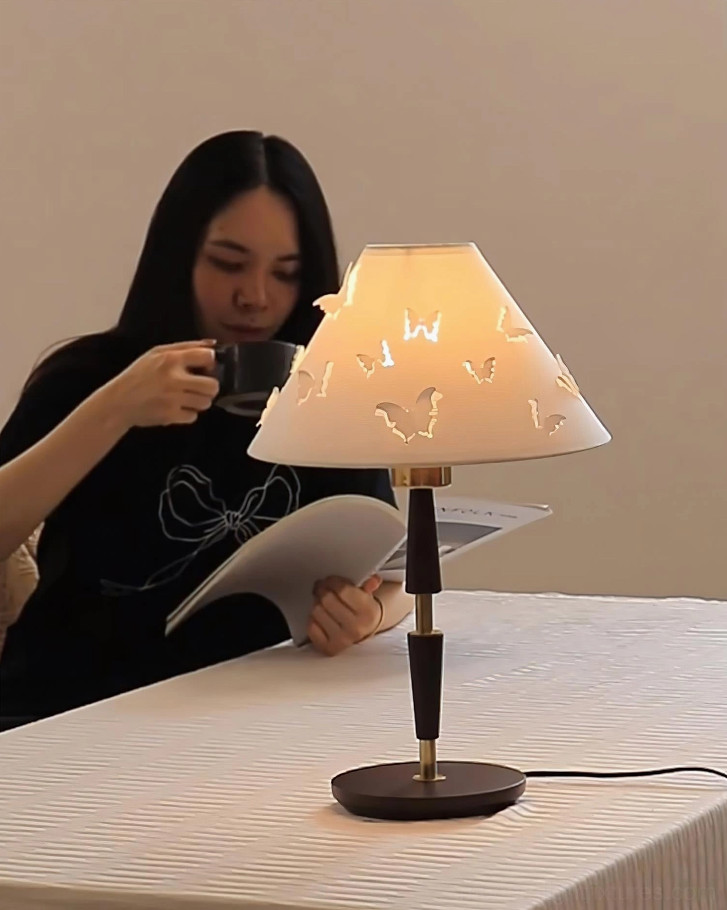 Butterfly perforated table lamp showcasing artistic shadow projection and contemporary design details