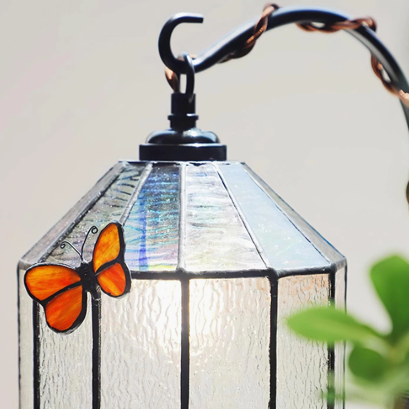 Illuminated stained glass butterfly lamp demonstrating warm ambient glow effect