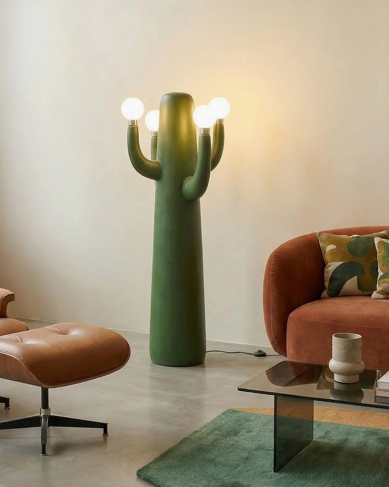 Matte green cactus floor lamp paired with terracotta furniture in retro modern home interior