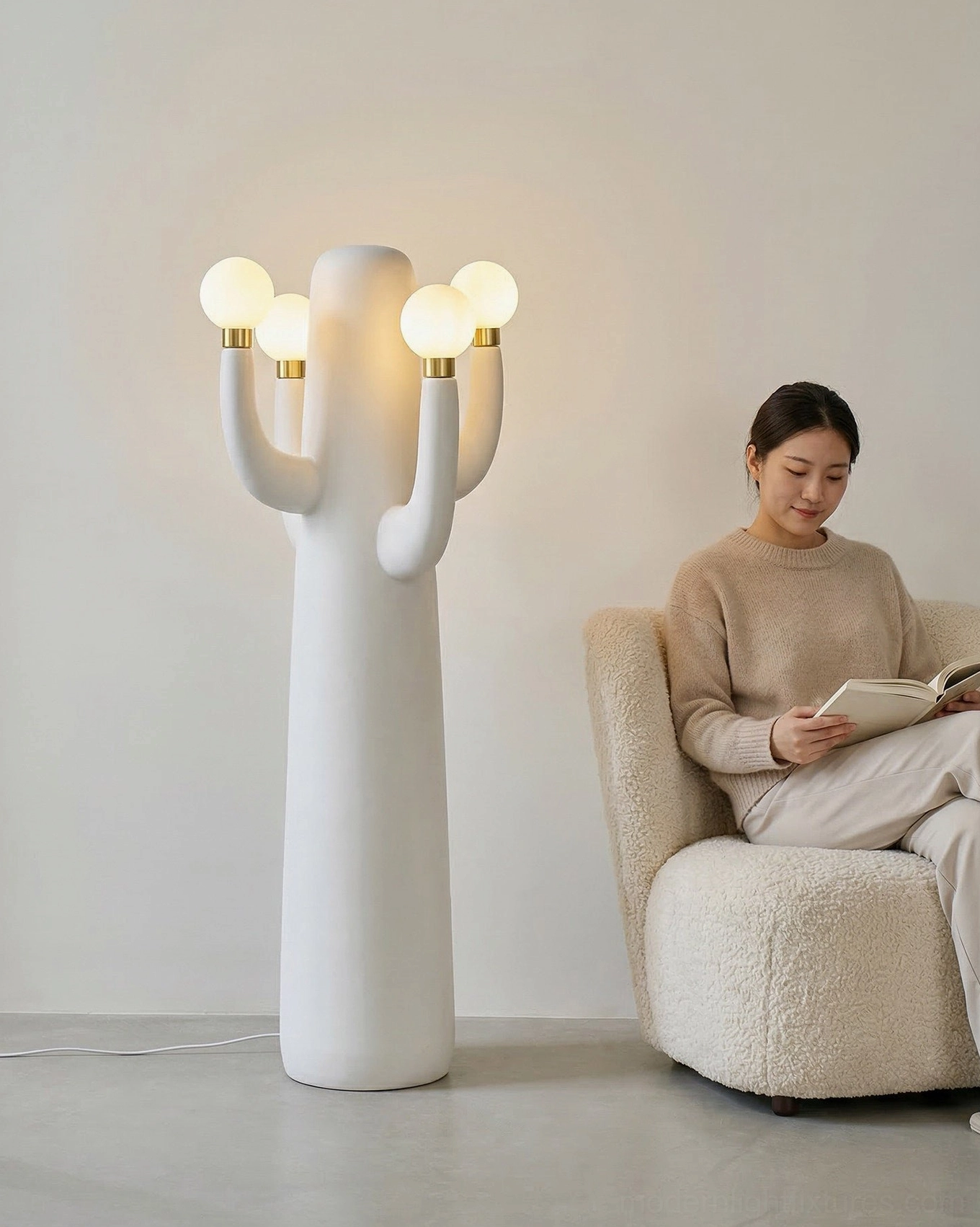White matte cactus floor lamp showing smooth resin construction and elegant branching form