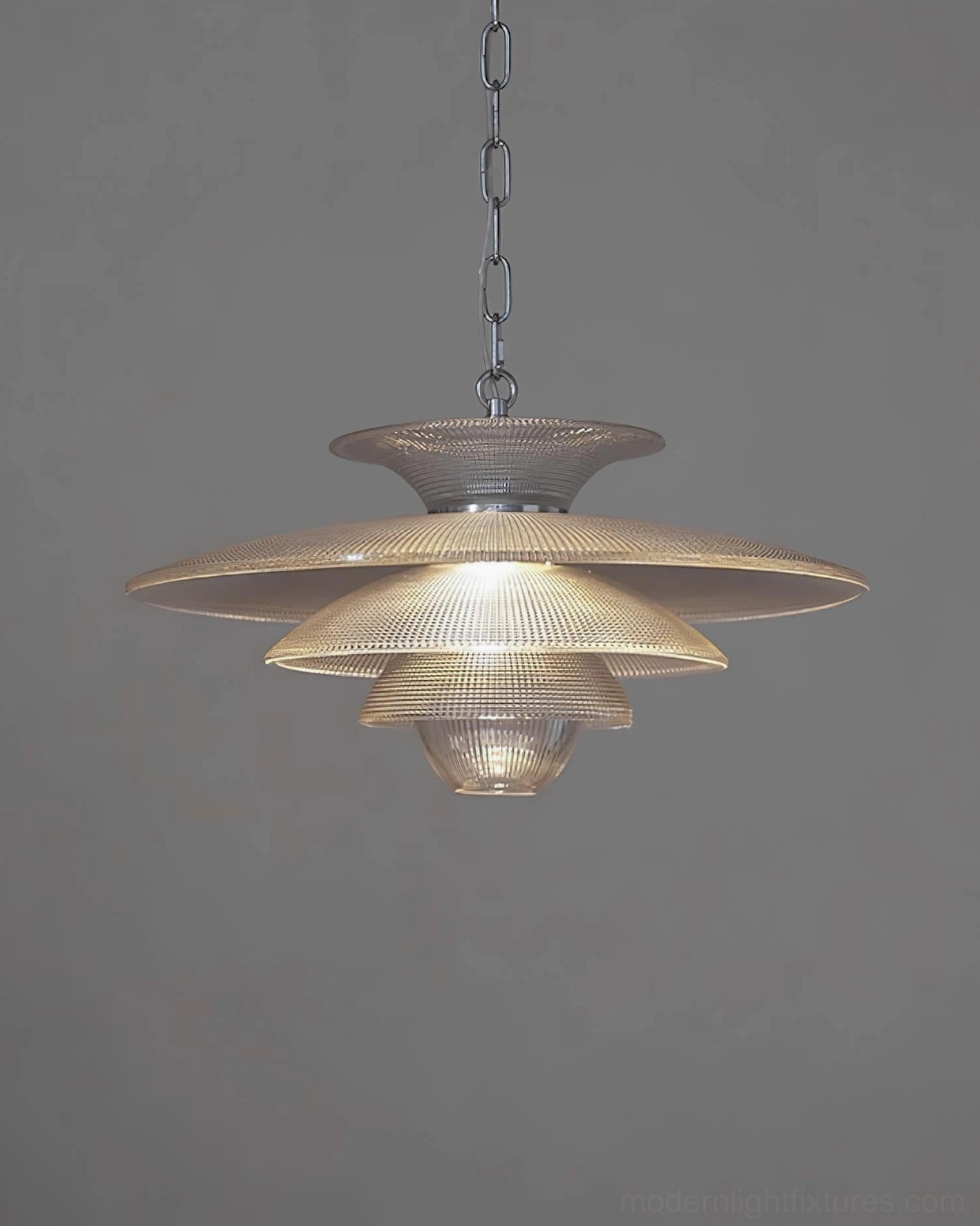 Cadenza glass pendant light bottom view showing flat ribbed shade and small top disc assembly in mid-century setting
