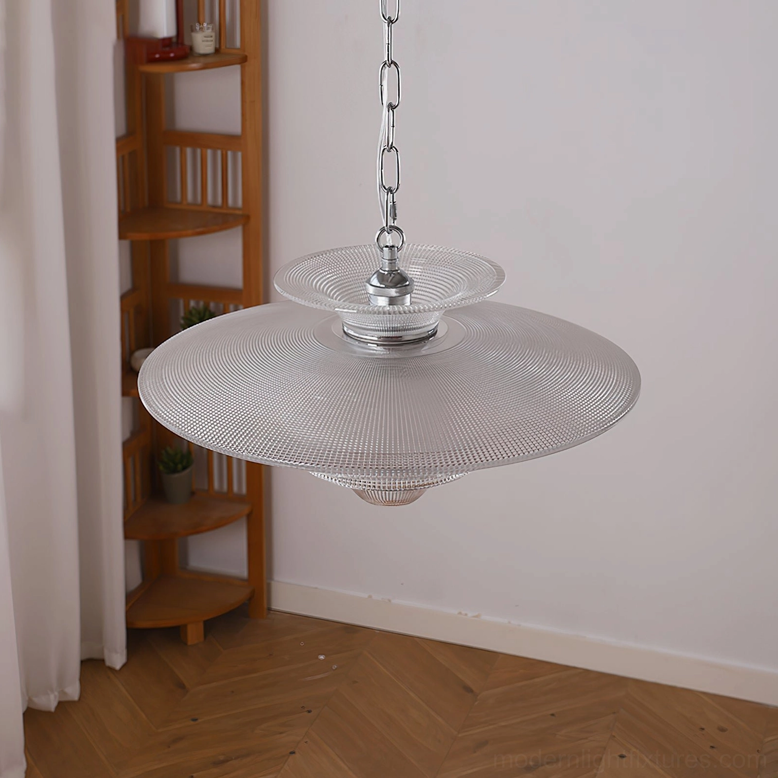 Cadenza glass pendant lamp installed in mid-century modern interior with wooden herringbone flooring, bottom-up view