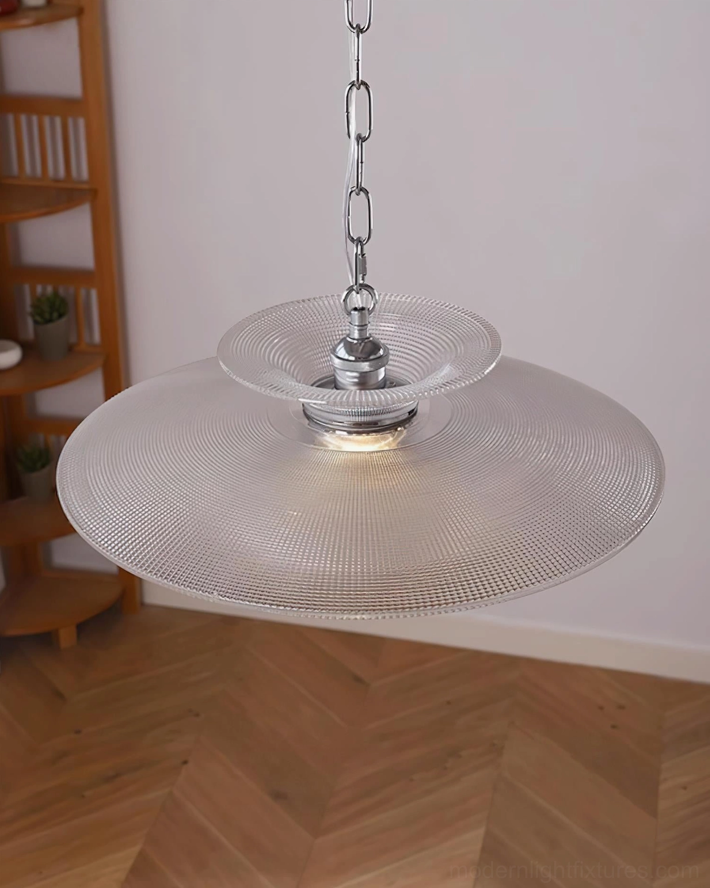 Cadenza single-tier large glass pendant lamp in residential mid-century modern interior with herringbone wood floor