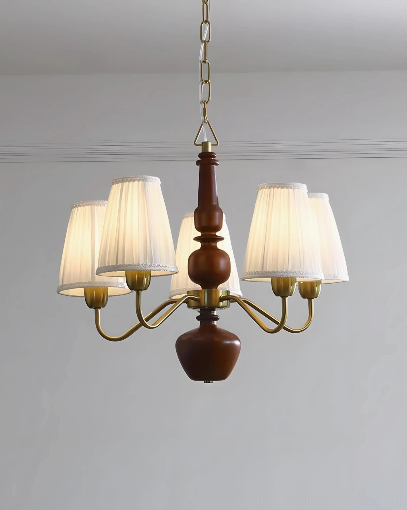 Vintage fabric chandelier with warm brass finish, dark brown wood detail, and off-white pleated shades