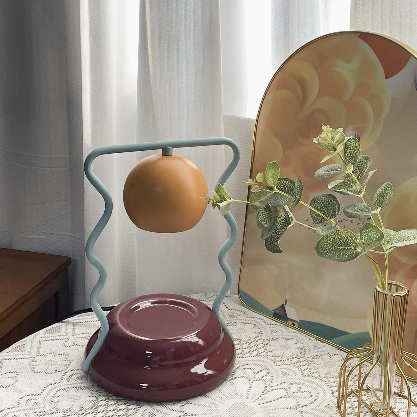 Caldas Candle Warmer Lamp styled on bedroom nightstand with lace tablecloth - contemporary table lamp design