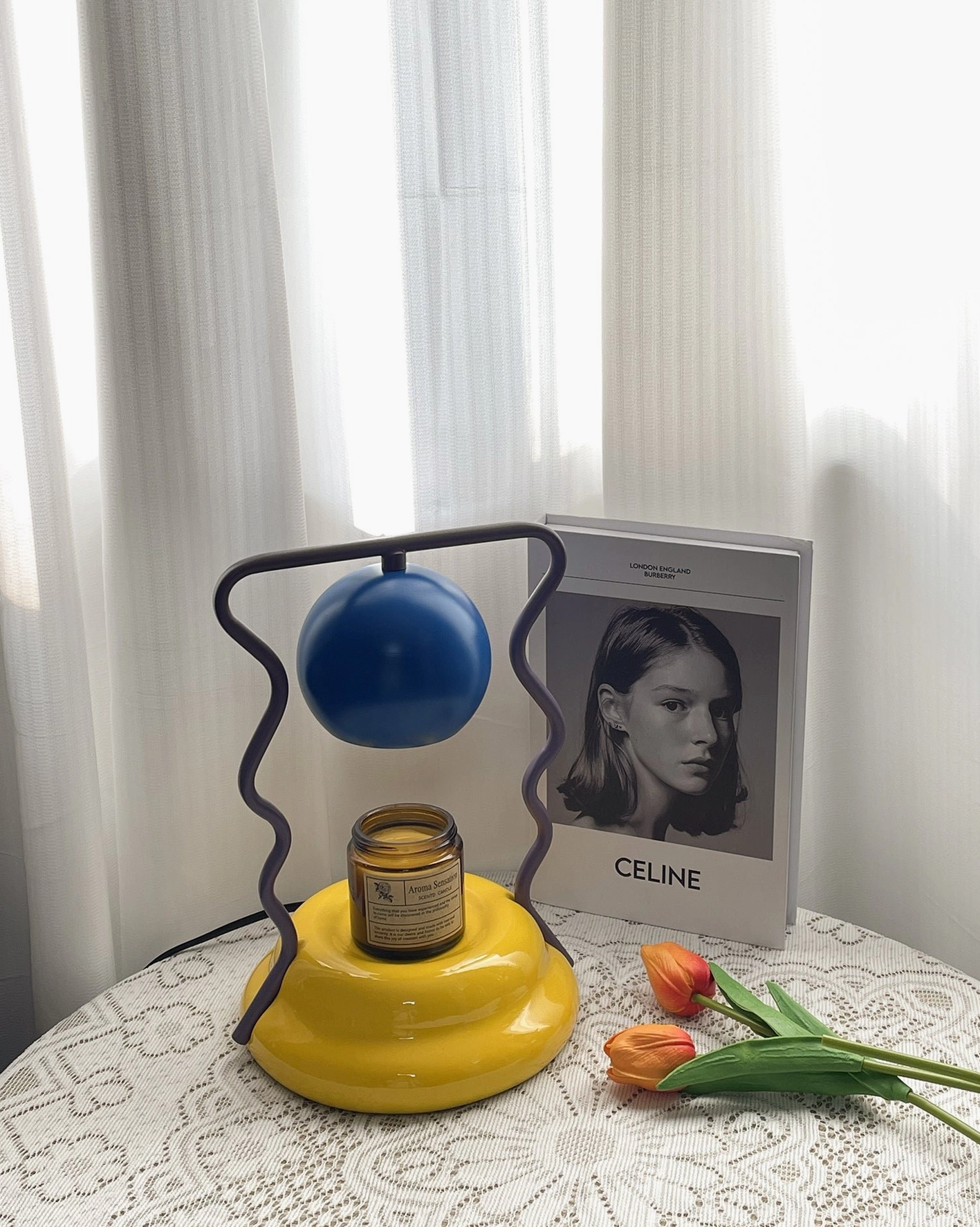 Caldas Candle Warmer Lamp detail view - artistic wavy metal frame spherical shade design