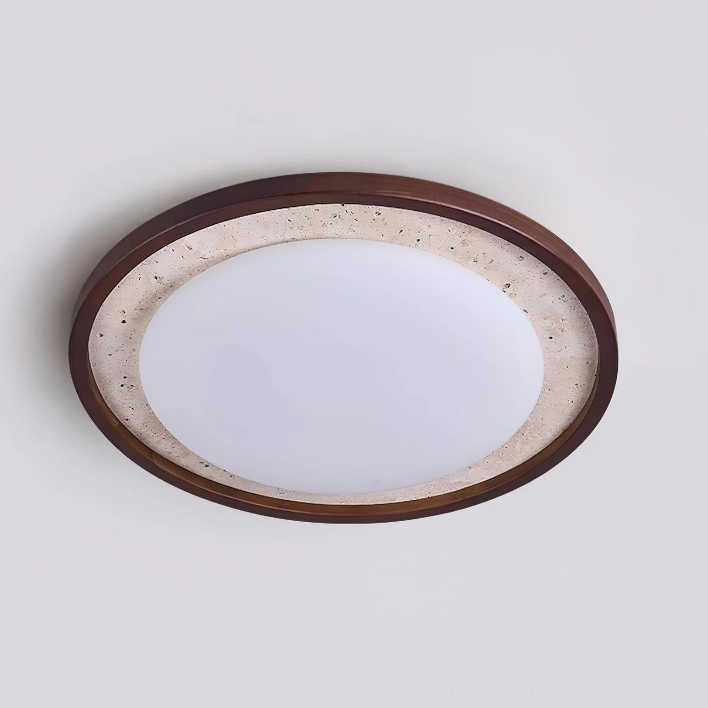 Caldo ceiling light fixture showing speckled travertine texture and warm wood trim