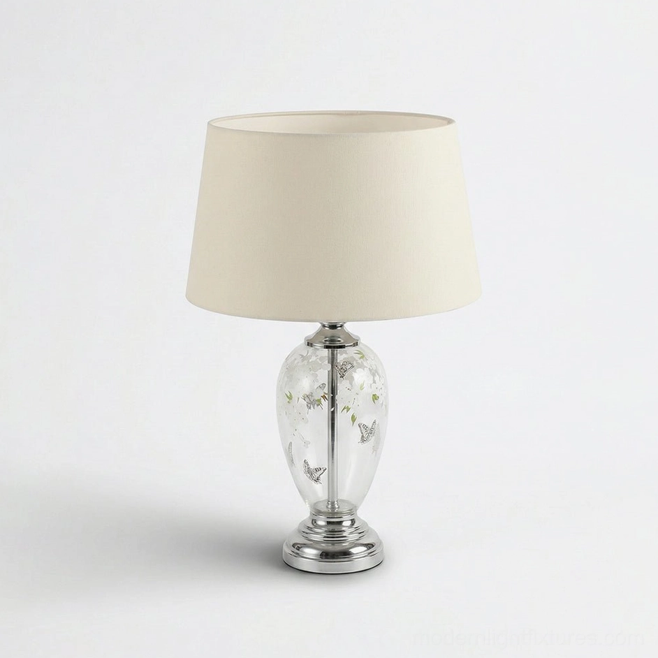 Calista glass table lamp with butterfly design chrome base cream shade