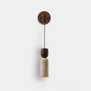 Calista Geode modern wall sconce with travertine stone shade and dark wood accents, front studio view
