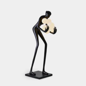 Calliope humanoid floor lamp front view studio display black matte finish frosted white glass globes modern sculptural lighting