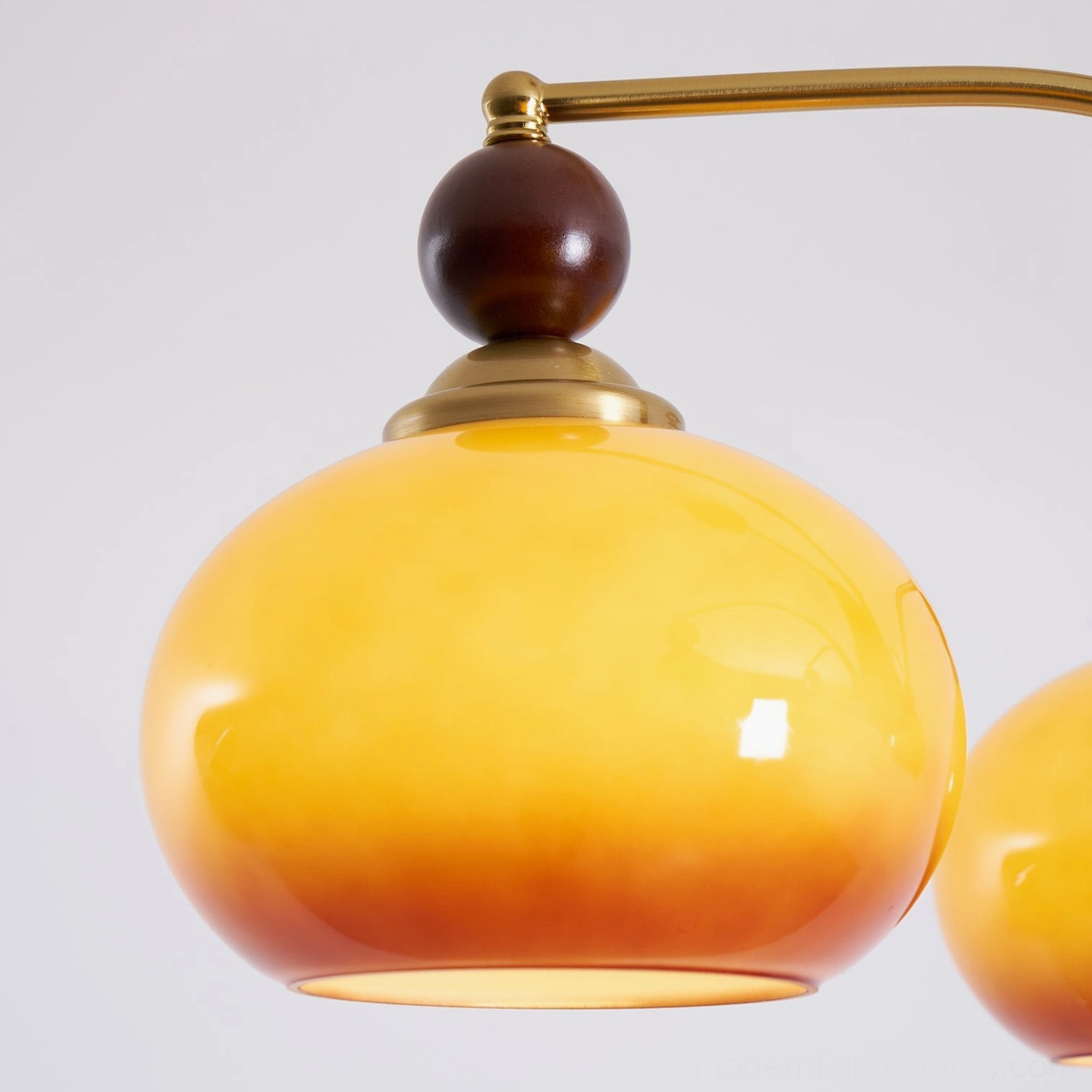 Calliope retro chandelier product view - warm glass shades with brass metal frame