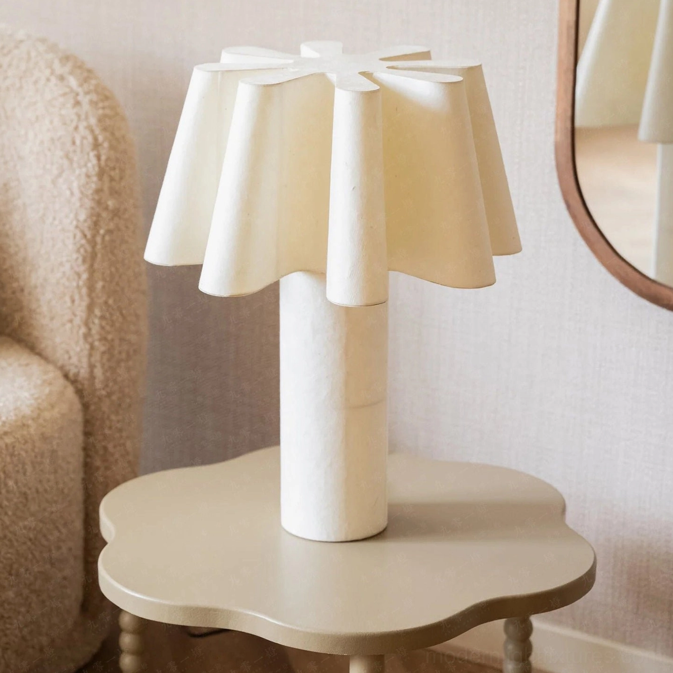 Calora white table lamp three-quarter view living room styling on scalloped side table
