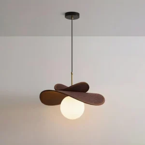 Caluma hanging pendant light side angle displaying dark brown wood layers and spherical white glass diffuser with ceiling mount