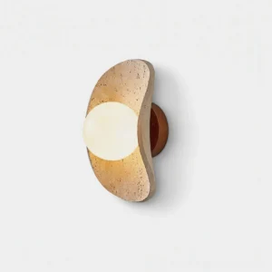Caluna travertine wall sconce front view with curved stone frame and frosted glass diffuser on white background