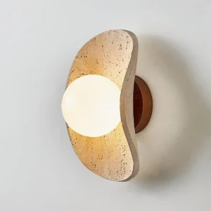Caluna wall sconce walnut color and beige stone side view showing sculptural curved travertine frame