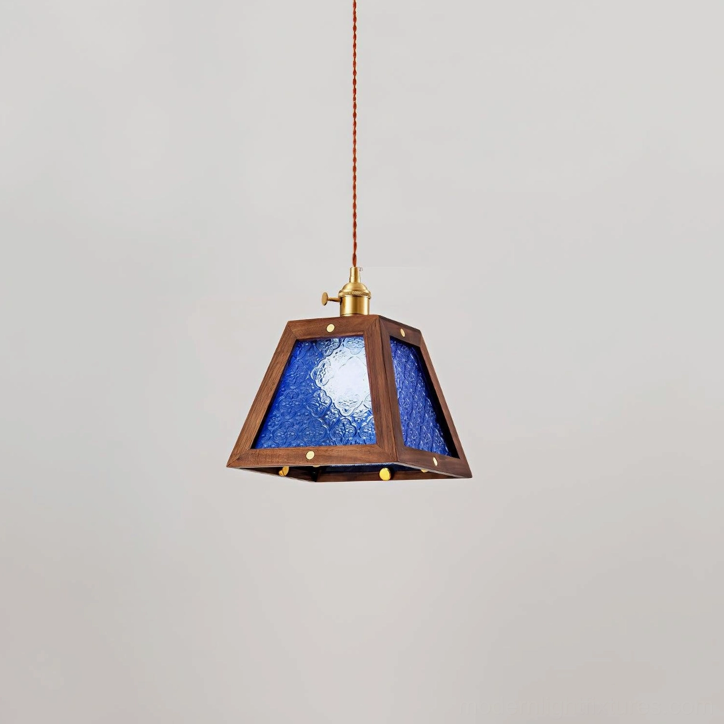 Calvi vintage glass pendant light with blue frosted shade, flat frontal view against neutral wall