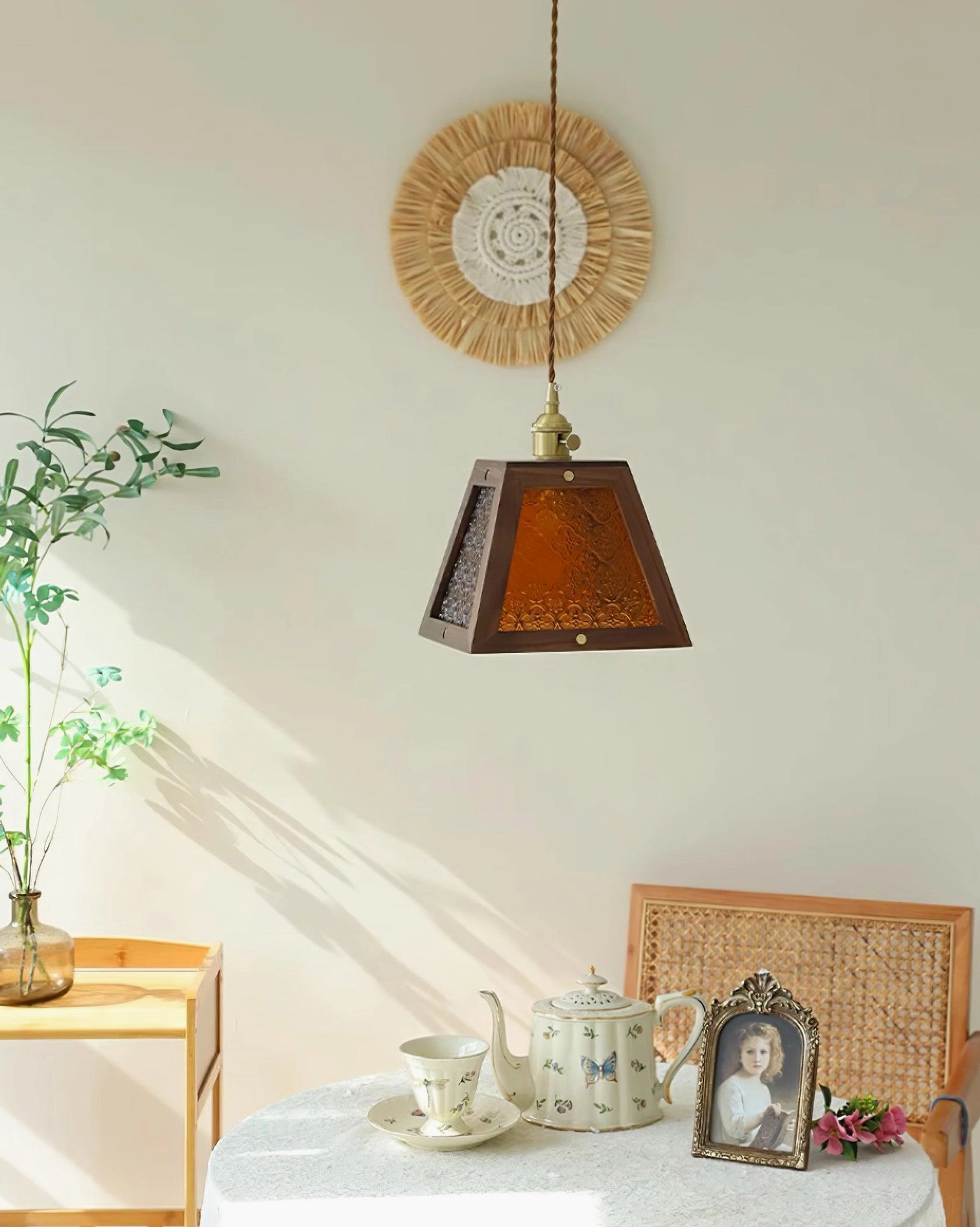 Calvi pendant light showing trapezoid silhouette with embossed glass and brass hanging hardware