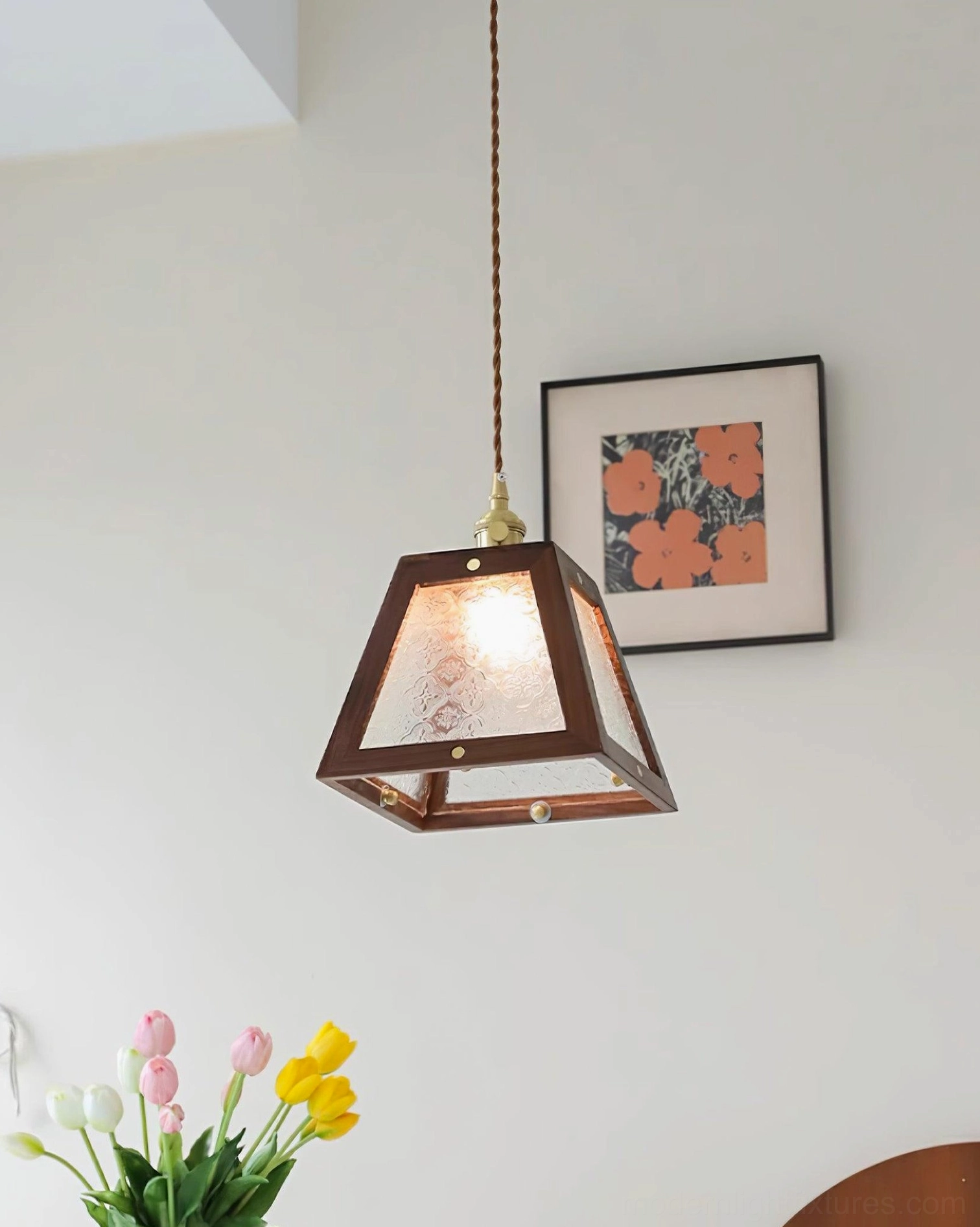 Vintage glass pendant lamp with textured shade, suspended from fabric cord with brass fittings