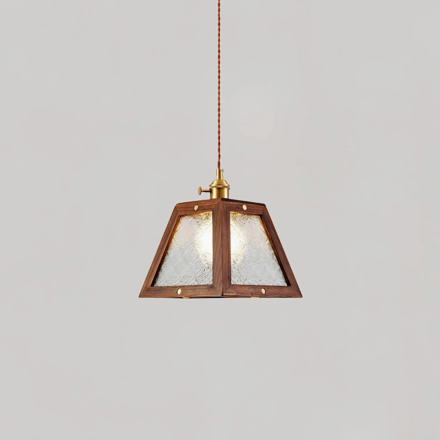 Glass pendant lamp with walnut wood frame and patterned shade, suspended fixture detail view