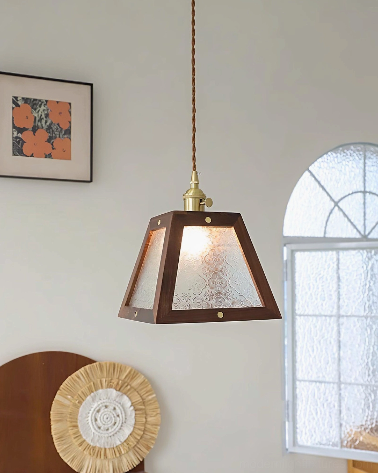 Vintage-inspired pendant light with trapezoid glass shade and aged brass accents, interior styling