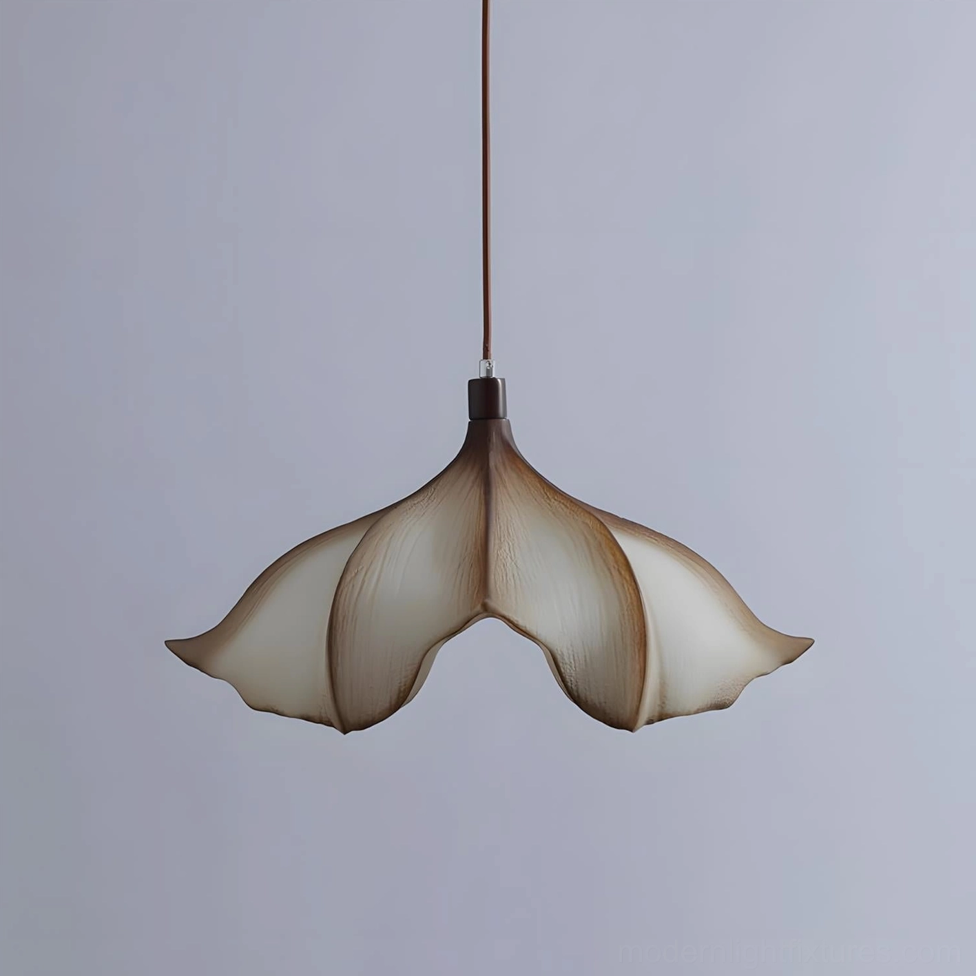 Calysa petal pendant lamp brown and beige variant full product view with warm diffused light transmission through shade