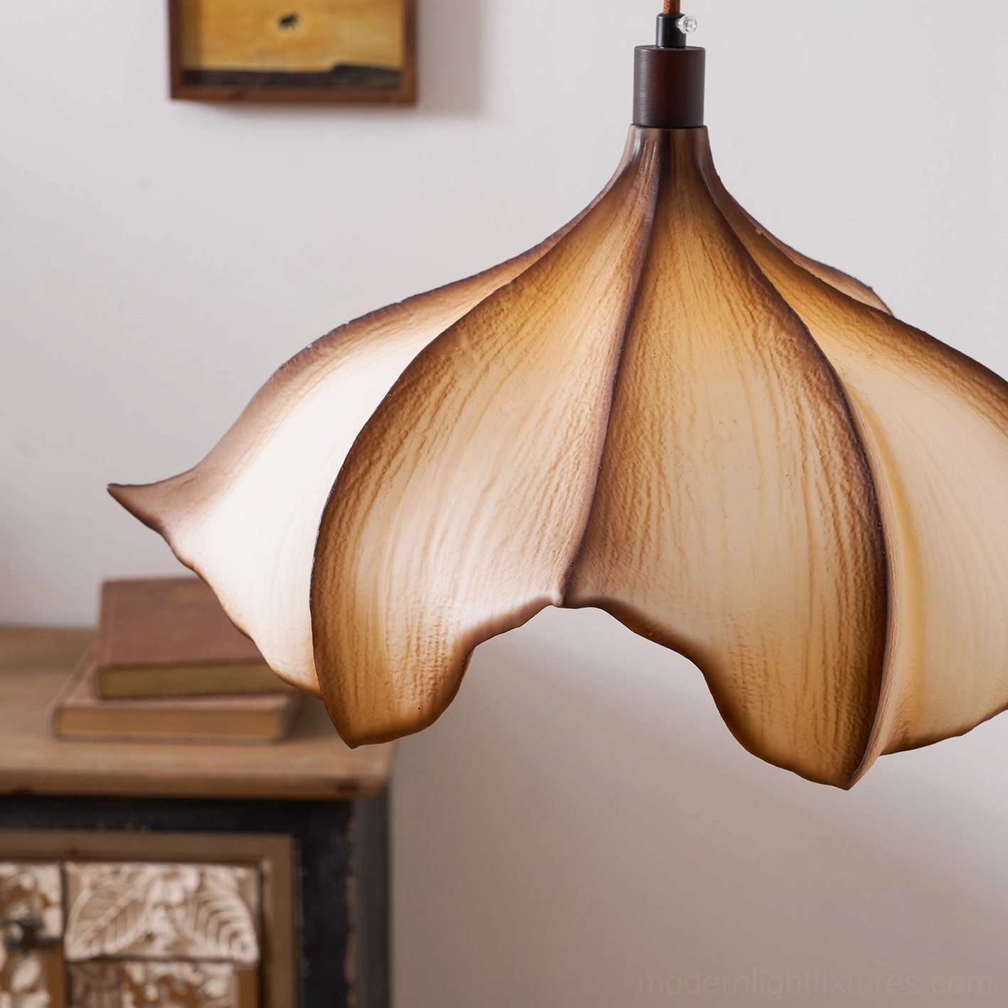 Calysa sculptural petal pendant light overhead view showing organic petal-form silhouette and light distribution